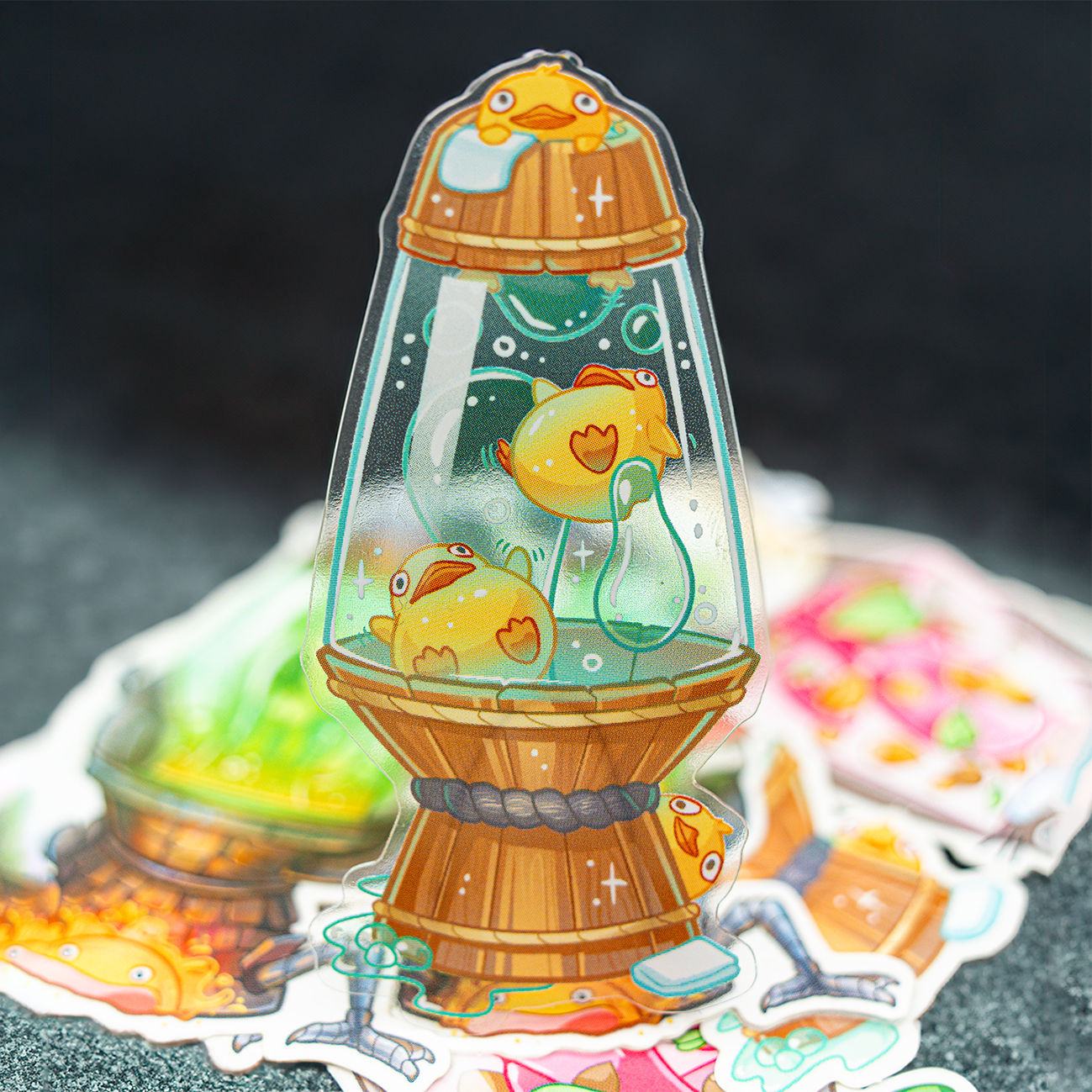 Transparent Ghilbi-inspired sticker of cute yellow ducks in a wooden barrel aquarium with bubbles and water plants, in a lava lamp design.